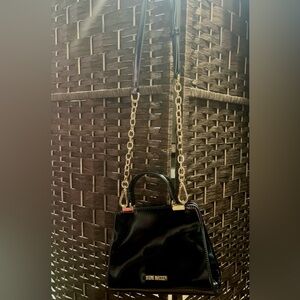 Steve Madden black hang bag. Great condition, used it twice.